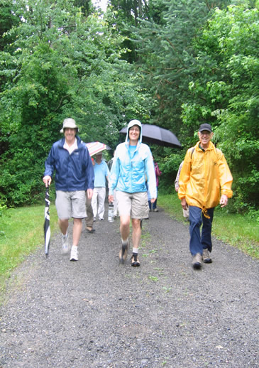 Peter (right) leads the hikers.